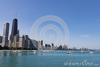 Beautiful Chicago Skyline along Lake Michigan with Boats and a Blue Sky during Summer Editorial Stock Photo