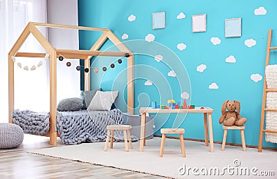 Beautiful child room interior with wooden furniture Stock Photo