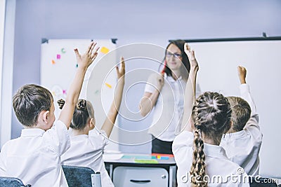 Beautiful children are students together in a classroom in school get the education with the teacher Stock Photo