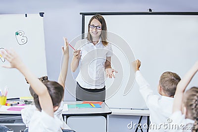 Beautiful children are students together in a classroom in school get the education with the teacher Stock Photo