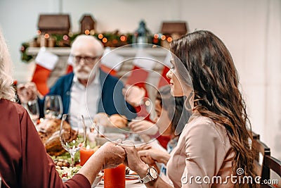 beautiful christian family praying before Stock Photo