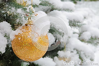 Beautiful Christmas decorations on a tree in the snow Stock Photo