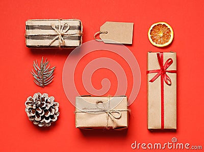 Beautiful Christmas gift boxes with ribbons and decors on color background Stock Photo