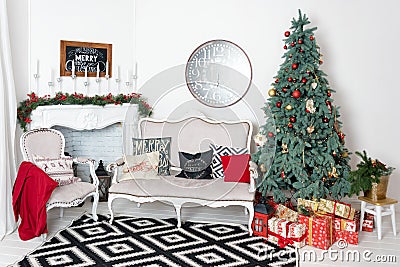 Beautiful Christmas interior. New year decoration. Comfort home. Classic new year tree decorated in a room with Stock Photo