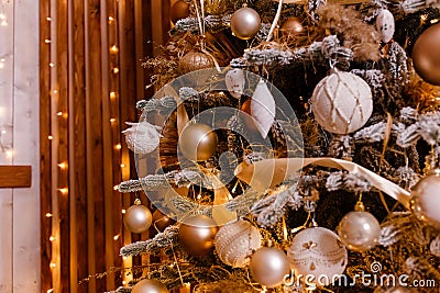 Beautiful Christmas tree is close. Golden Christmas. golden and white balls on Christmas tree branches Stock Photo