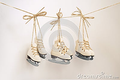 Christmas tree decoration small three pair of ice skates on the rope Stock Photo