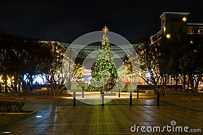 Beautiful Christmas tree and street decorations at night in downtown Frisco Editorial Stock Photo