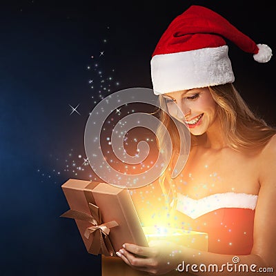 Beautiful christmas woman open fairy gift Stock Photo