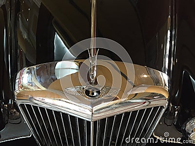 Beautiful chromed car emblem on a black patent surface. Editorial Stock Photo