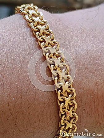 Beautiful circular 24 carat gold bracelet Stock Photo