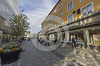 Beautiful cityscape view of Uppsala downtown street with walking people on bright day. Sweden. Europe. Editorial Stock Photo