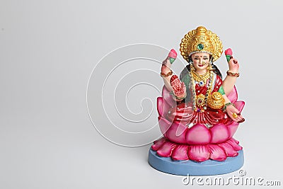 Beautiful Clay Idol of Hindu Goddess Lakshmi OR Laxmi on white background Stock Photo