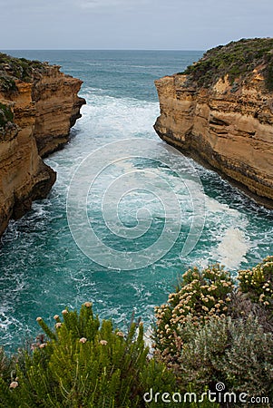 Beautiful cliffs and wavy sea at the Great Ocean Road in Australia Stock Photo