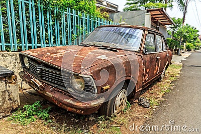 Rusty old car Jakarta Stock Photo