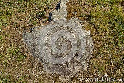 Beautiful close up view of part of gray stone overgrown with green moss. Stock Photo