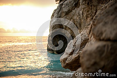 beautiful close-up view of part of rock along sea and skyline Stock Photo