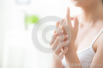 Beautiful closeup asian woman applying cream and treatment for skin care touch on hand, asia girl with lotion spa and moisturizing Stock Photo