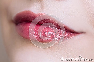 Beautiful closeup female plump lips with bright color makeup Stock Photo