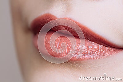Beautiful closeup female plump lips with bright color makeup Stock Photo