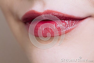 Beautiful closeup female plump lips with bright color makeup Stock Photo