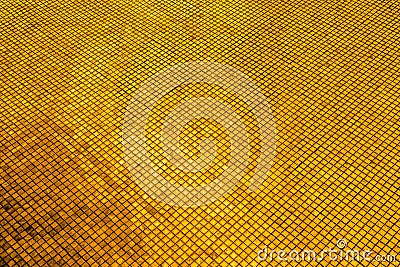 Beautiful closeup textures abstract color dark yellow and gold tiles granite and gold glass pattern wall and background and art Stock Photo