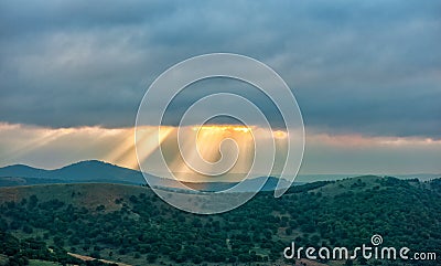 Beautiful clouds with ray of sunlight breaking through clouds Stock Photo