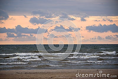 Beautiful clouds and sunset over seaside. Stock Photo