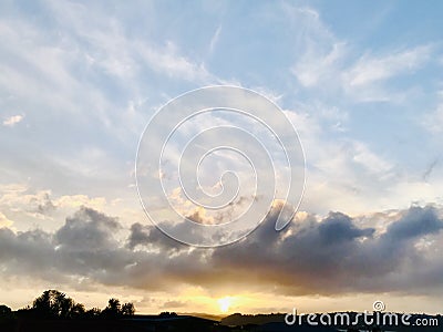 Beautiful cloudscape view at sunset. Stock Photo
