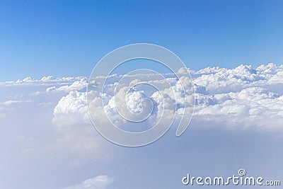 Beautiful cloudy sky from aerial view. Airplane view above clouds. Stock Photo