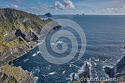 Beautiful coastline at the Ring of Kerry, Ireland. Huge cliffs at the Ring of Kerry Ireland. View on the Skellig Islands Stock Photo