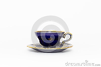 Beautiful cobalt blue colored vintage porcelain tea cup with gold ornament Stock Photo