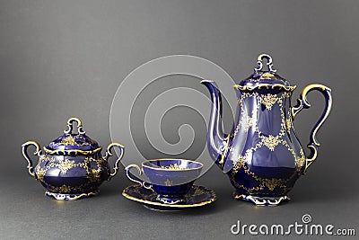 Beautiful cobalt blue colored vintage porcelain tea set with gold ornament Stock Photo