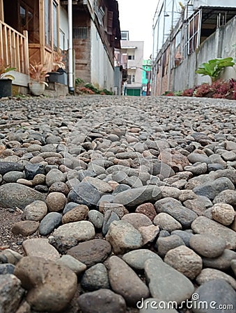 a beautiful cobblestone street with houses on each side Stock Photo