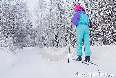 Beautiful cold forest view of ski run track on ski resort, winter day on a slope, pist, nordic skier on the track in winter, Stock Photo