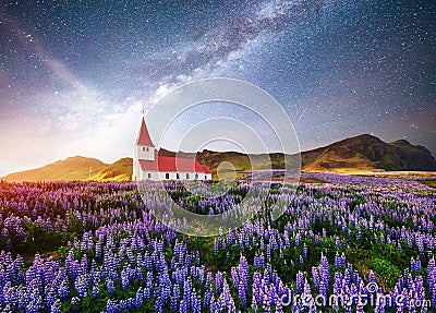 Beautiful collage Lutheran Church in Vik under fantastic starry sky. Iceland Stock Photo