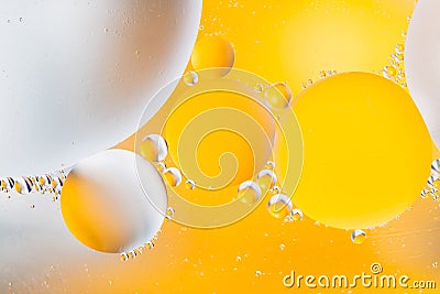 Beautiful color abstract background from mixied water and oil. Pastel colored abstraction. Yellow and white background from water Stock Photo