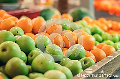 Beautiful color combination, variety of fresh raw fruits background display at market stall Stock Photo