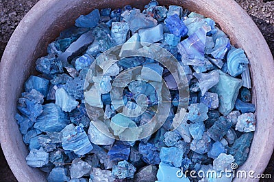 Beautiful colorful blue stones in clay vessels background Stock Photo