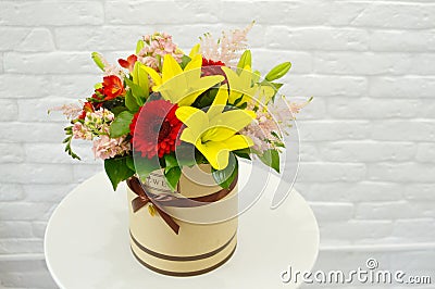 Beautiful colorful bouquet of flowers in a hat box Stock Photo