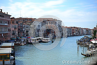 Beautiful colorful city of Venice, Italy, with Italian architecture, gondola, boats and bridges over canal Editorial Stock Photo