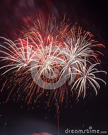 Beautiful colorful holiday fireworks on the black sky background, long exposure Stock Photo