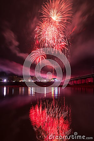 Beautiful colorful holiday fireworks on the black sky background, long exposure Stock Photo