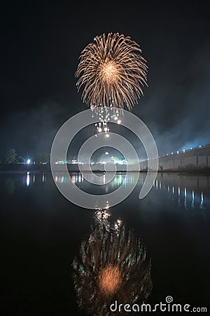 Beautiful colorful holiday fireworks on the black sky background, long exposure Stock Photo