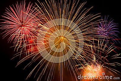 Beautiful colorful holiday fireworks on the black sky Stock Photo