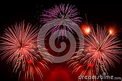 Beautiful colorful holiday fireworks on the black sky Stock Photo