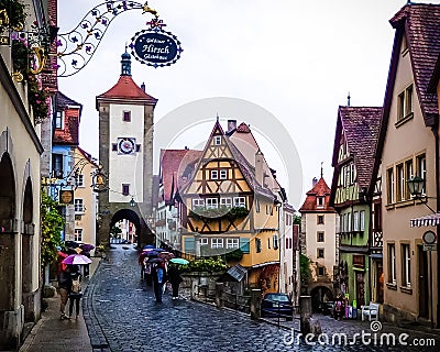 Storybook medieval town of Rothenburg ob der Tauber on a rainy day. Editorial Stock Photo