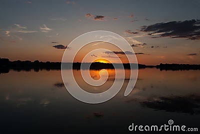 A beautiful colorful summer sunrise on the Dnipro river in Tobeltsi village, Ukraine. Stock Photo