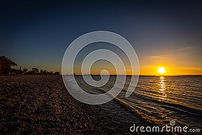 Beautiful colorful sunset over the beach of lake Neusiedler in Podersdorf Stock Photo