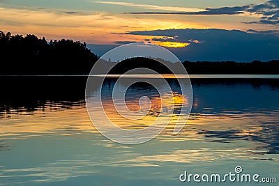 Beautiful sunset reflecting on a lake Stock Photo