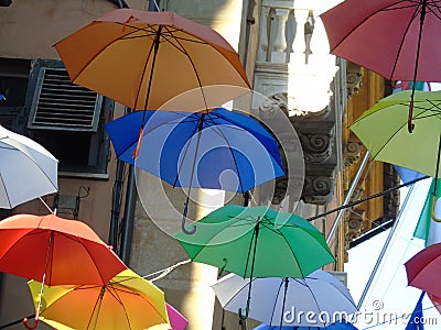 Beautiful coloured umbrellas over the city of Genova Editorial Stock Photo